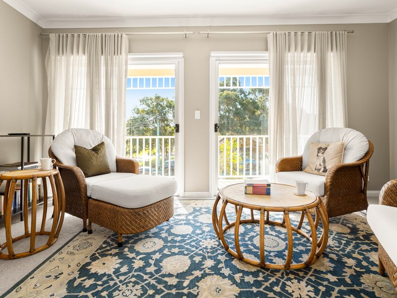 Relax in the sunny sitting area with views over the surrounding greenery.