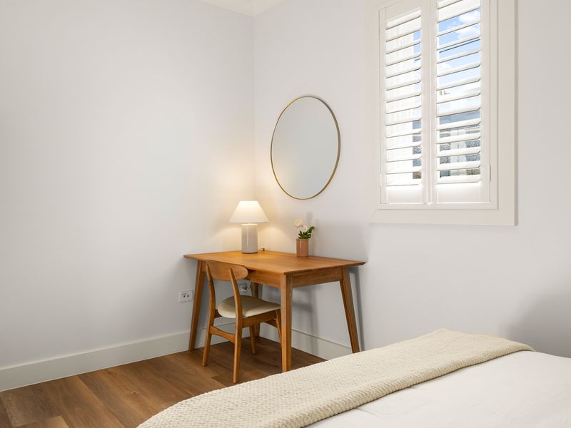 Work or get ready at the convenient desk and vanity area.