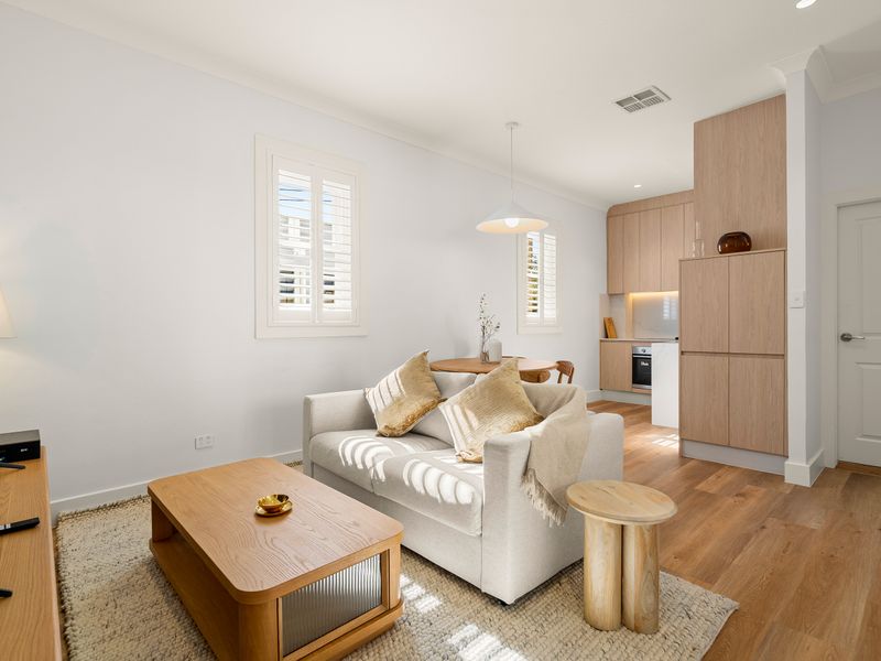 Spacious lounge with comfortable seating and Smart TV.