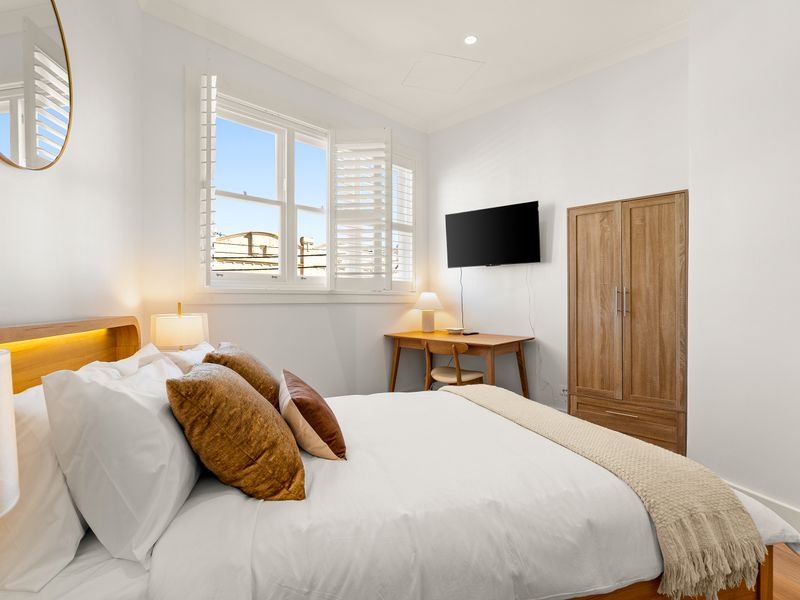 Wake up to natural light in this thoughtfully styled bedroom retreat.