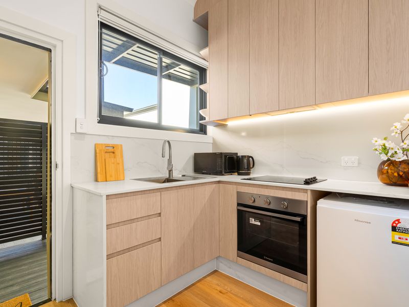 Contemporary kitchen with quality appliances and generous bench space.