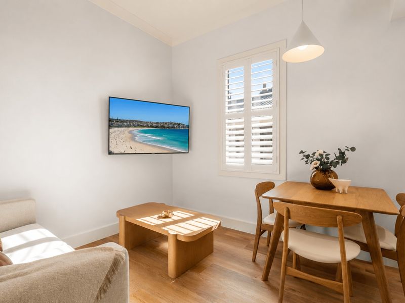 Comfortable lounge with TV and dining space to unwind.