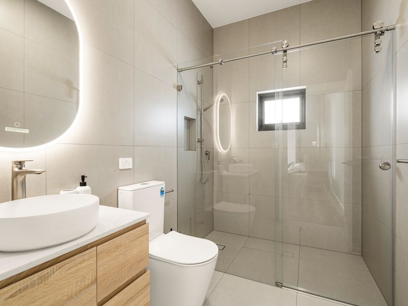 Modern bathroom featuring a spacious glass shower.