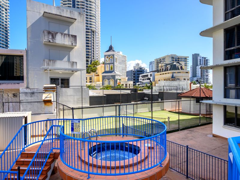 Tennis court and pool area within the complex