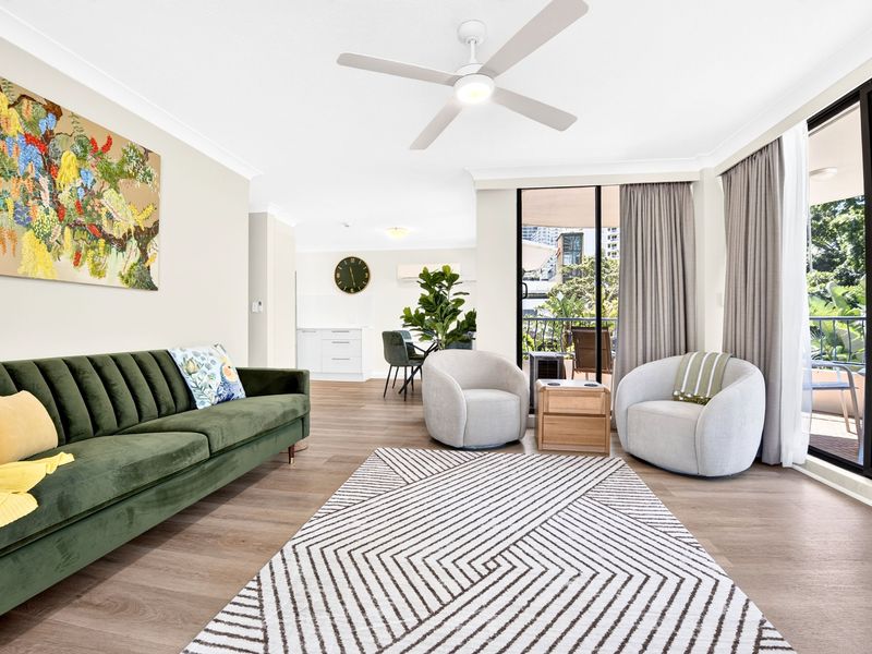 Open-plan lounge flowing to the balcony