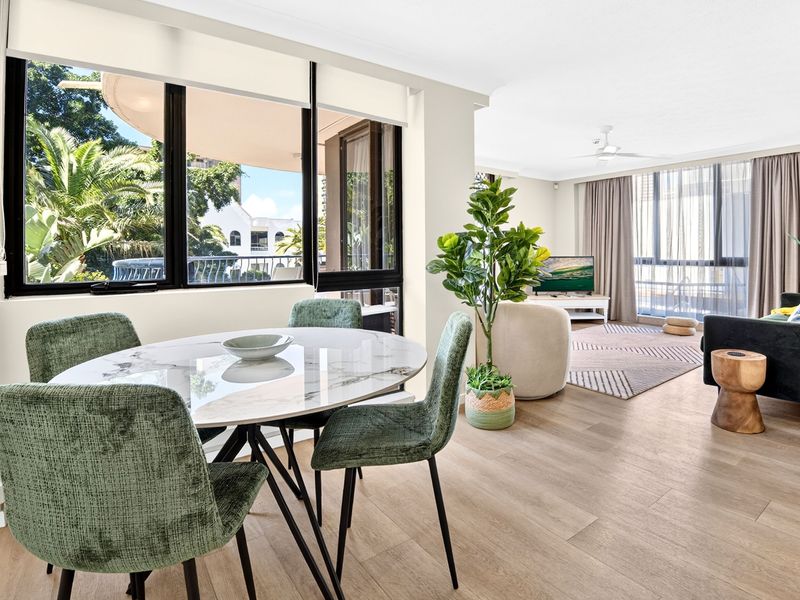 Dining area overlooking leafy tropical surrounds