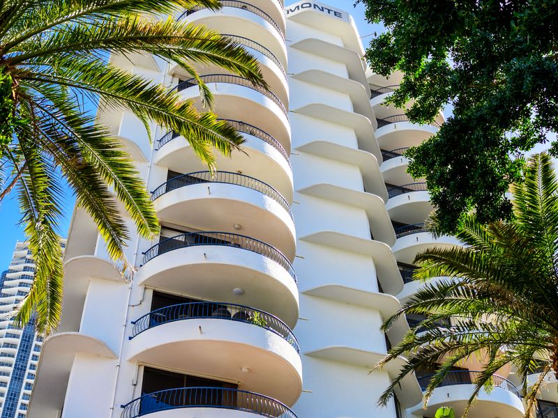 Resort-style building surrounded by tropical palms