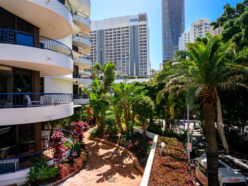 Balcony overlooking lush gardens and resort surroundings