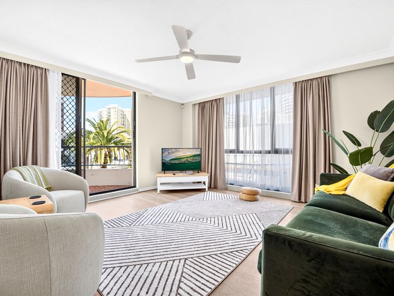 Spacious, light-filled living room with stylish seating.