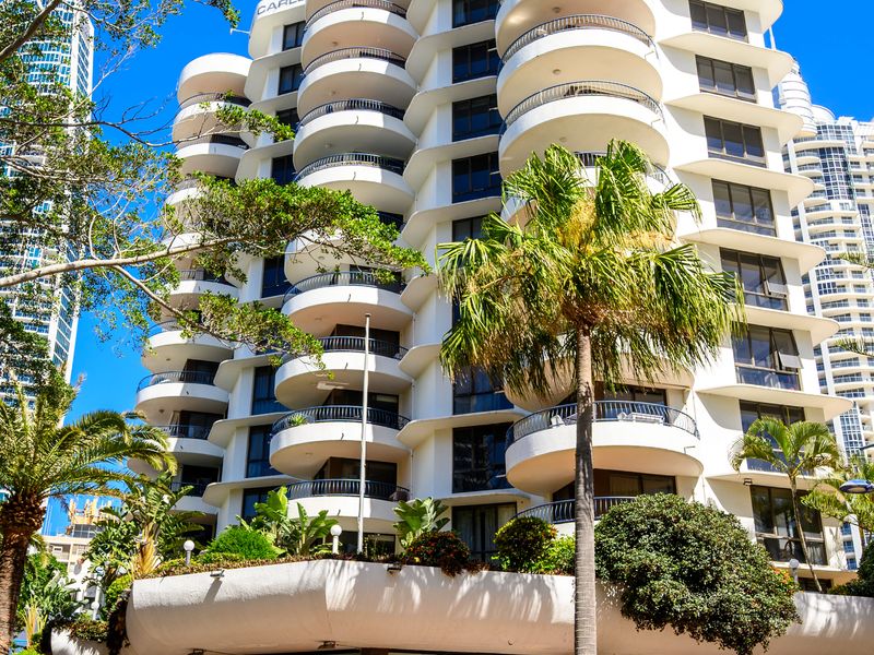 Striking resort-style architecture surrounded by palms