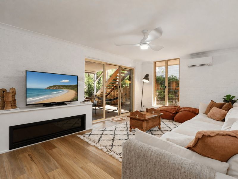 Comfortable living space with Smart TV and seamless indoor-outdoor flow