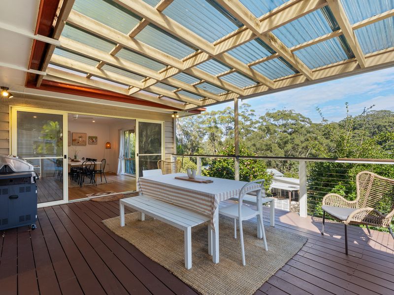 Spacious covered entertaining deck with BBQ and outdoor dining