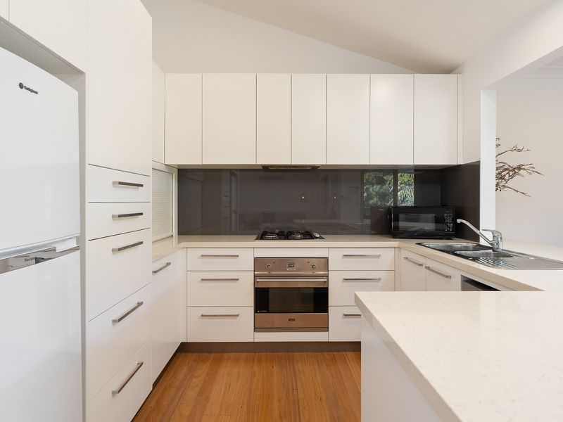 Modern, fully equipped kitchen with generous bench space