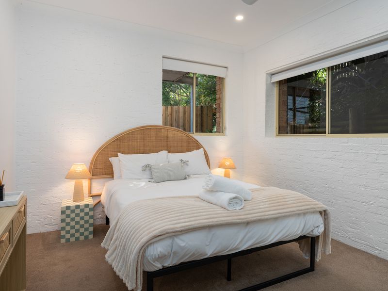 Peaceful queen bedroom with leafy outlooks and plenty of natural light