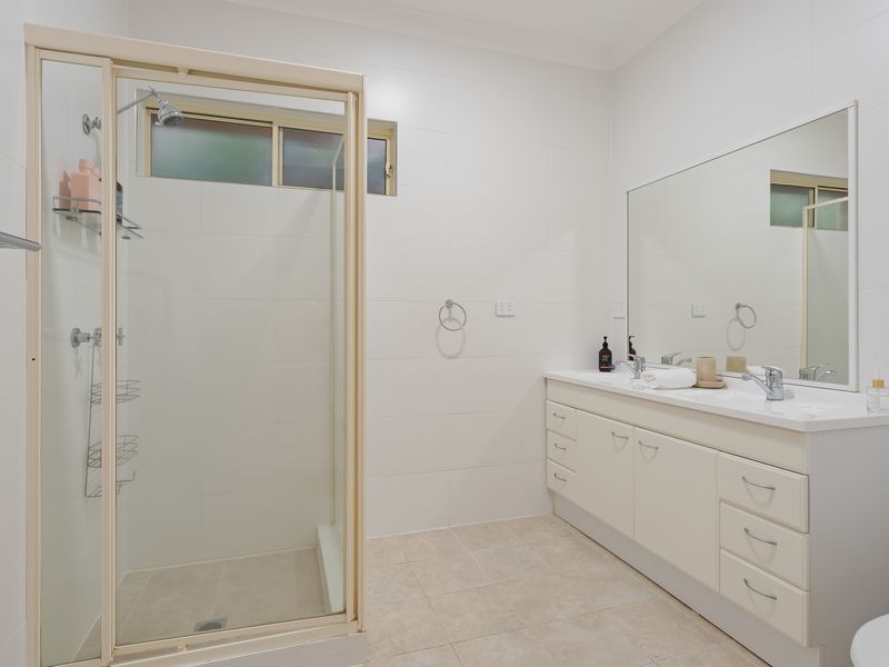 Bright bathroom with walk-in shower and generous vanity space