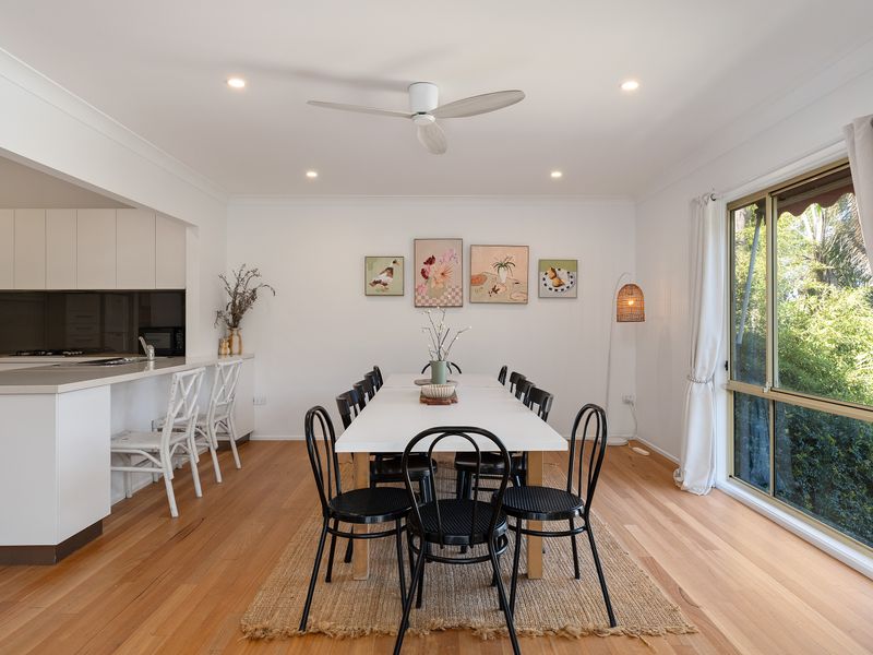 Bright dining space with leafy outlooks and room for everyone