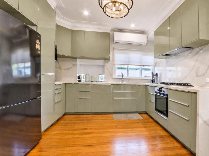 Fully equipped kitchen featuring sleek cabinetry and appliances.