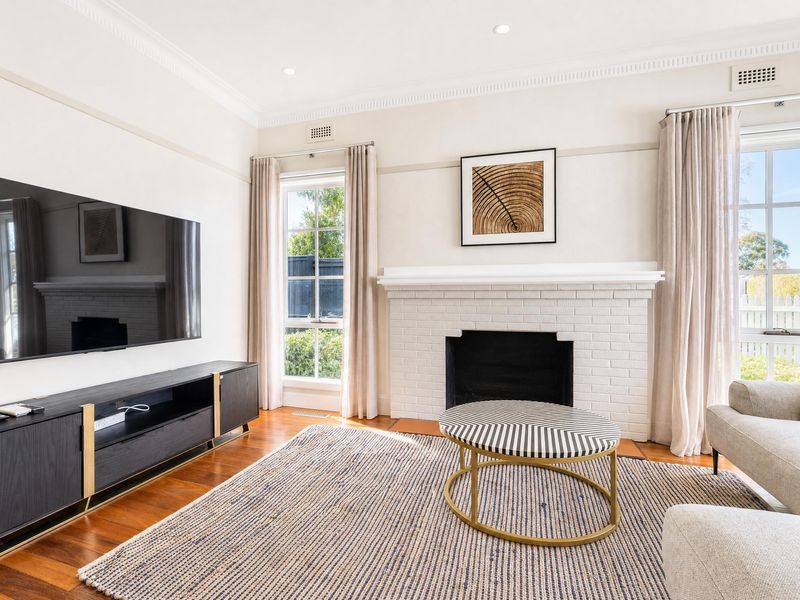 Modern living space featuring a large wall-mounted TV