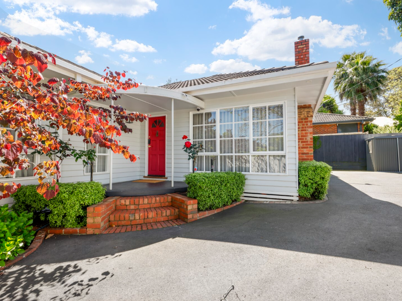 Charming exterior view of the house with private parking space.