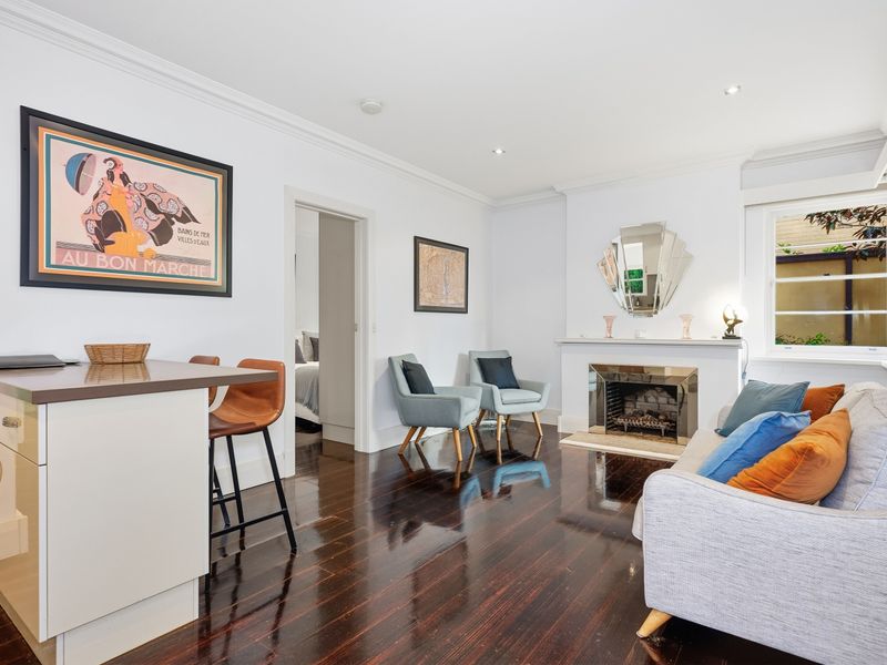Wide view of the open-plan living, dining, and kitchen area.