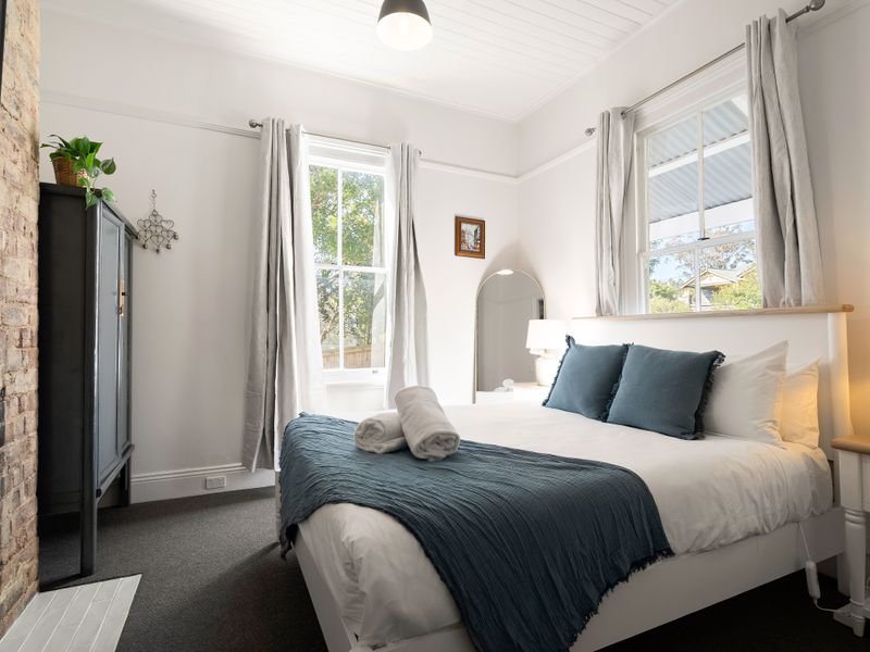 Serene bedroom with garden views and classic furnishings