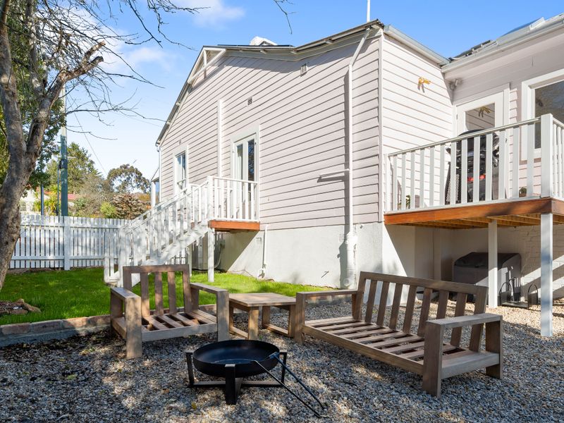 Private outdoor area with a deck and fire pit
