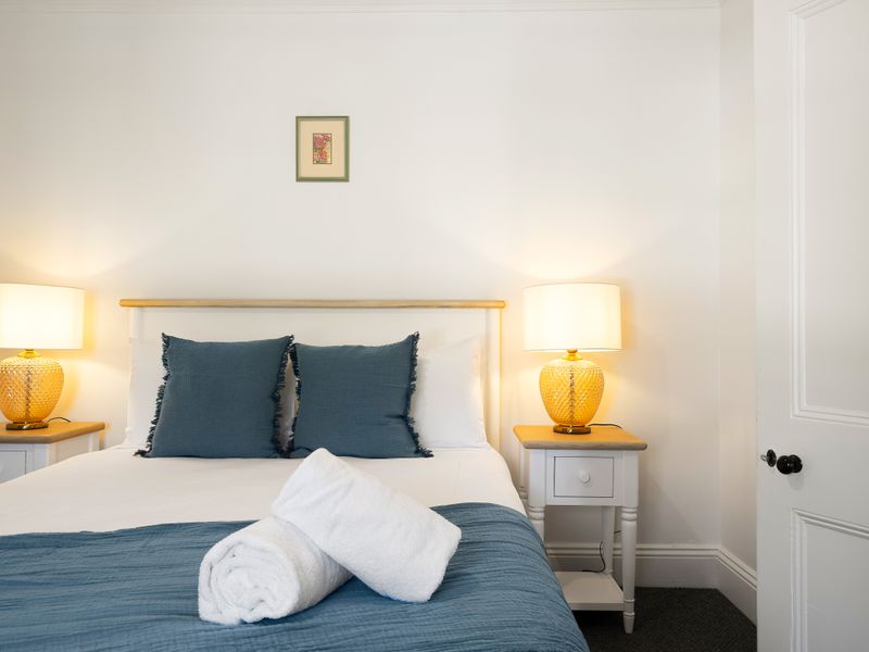 Comfortable bedroom with soft lighting and calming tones