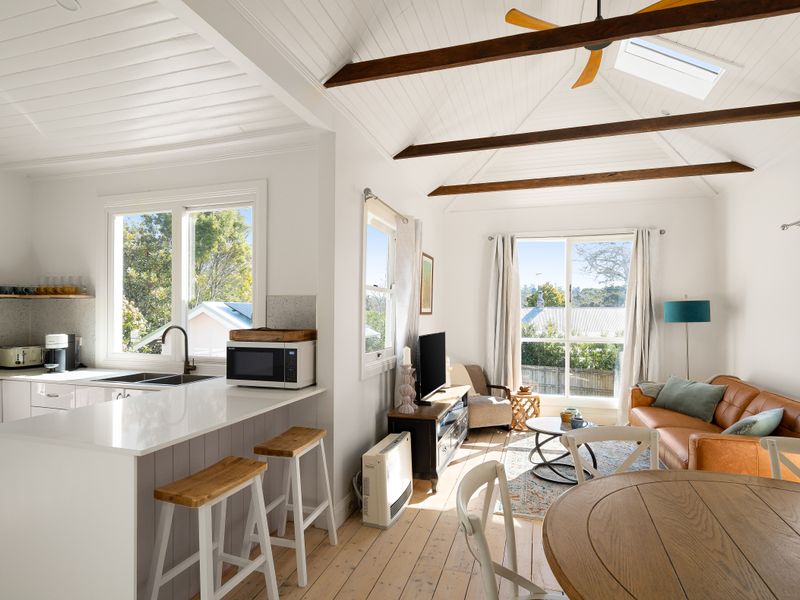 Open-plan kitchen and living area with plenty of natural light