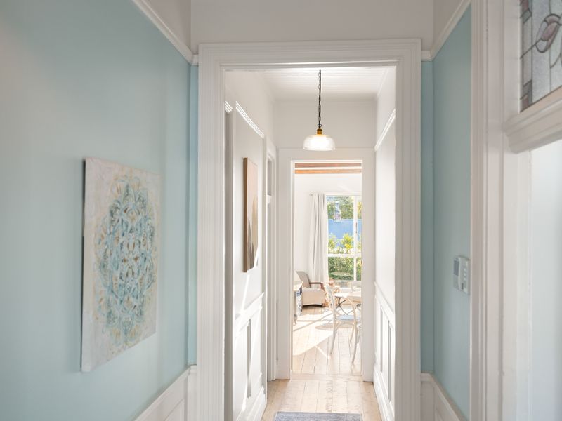 Bright interior hallway connecting the rooms of the home.