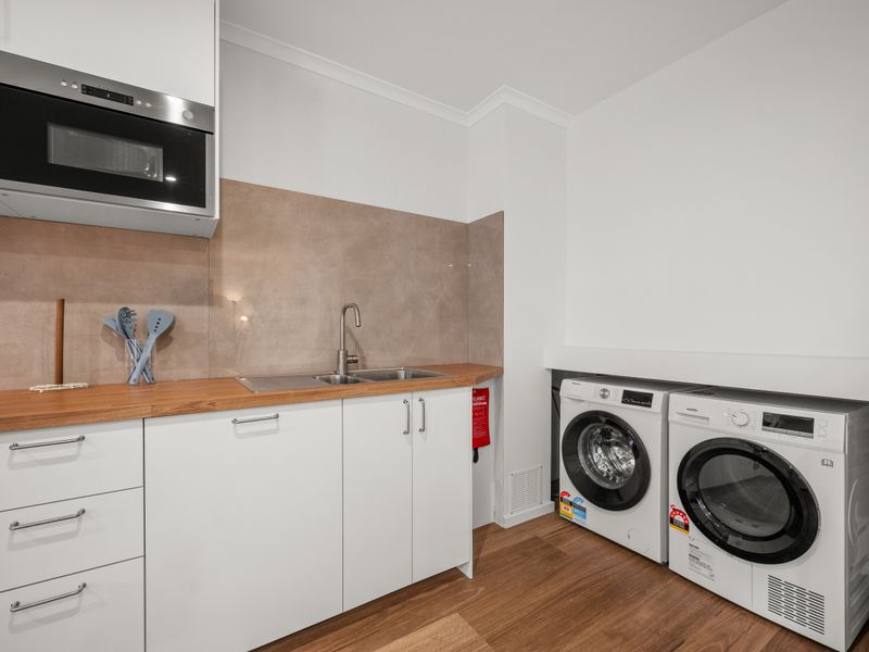 Kitchen counter detail featuring built-in appliances.
