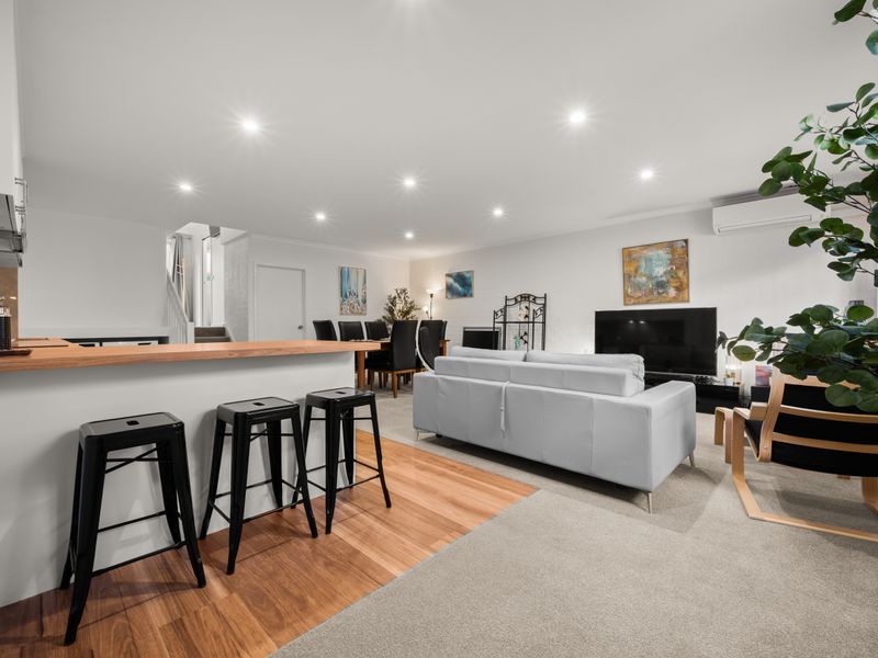 Open-plan living space looking toward the kitchen and dining area.