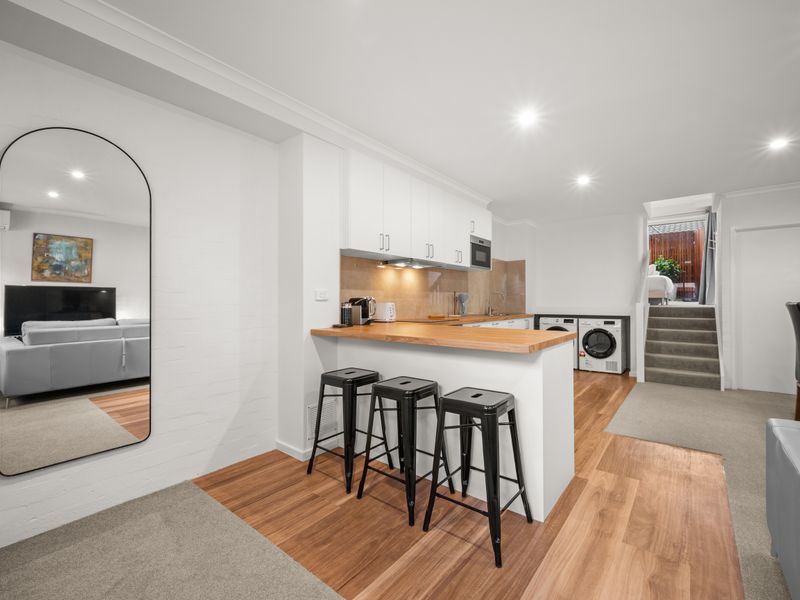 Kitchen and living space angle highlighting the open floor plan.