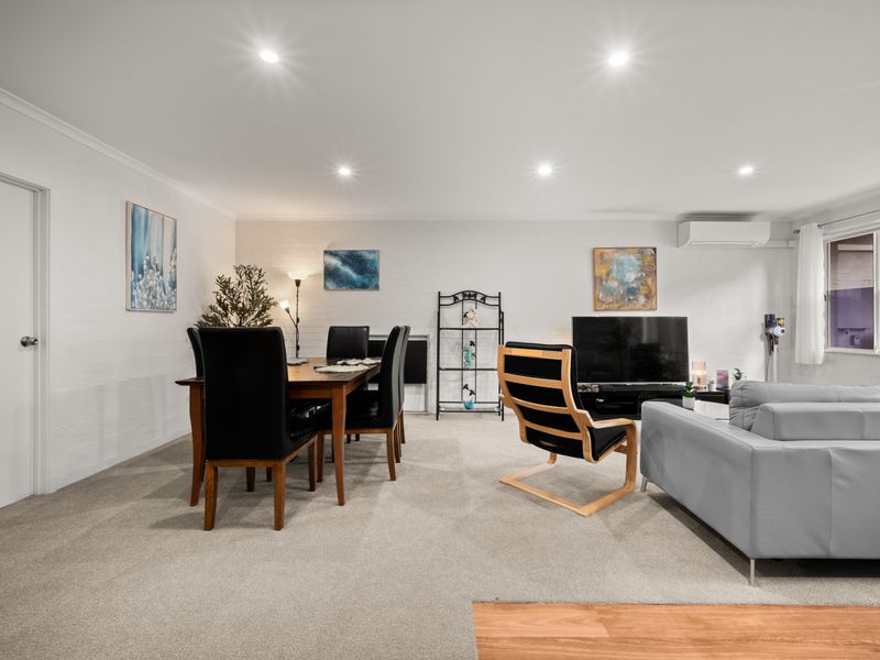 Open and bright living and dining area with comfortable seating.