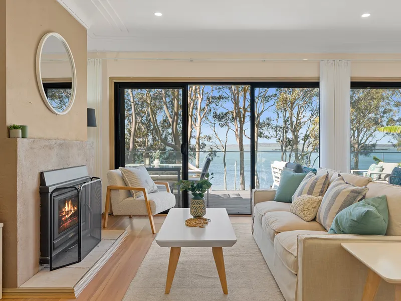 Relax in the comfortable lounge room, the perfect spot to unwind, gather with family and friends, and enjoy the peaceful surroundings.