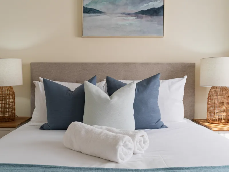 Queen bed provide a relaxing space to unwind and enjoy a restful night's sleep.