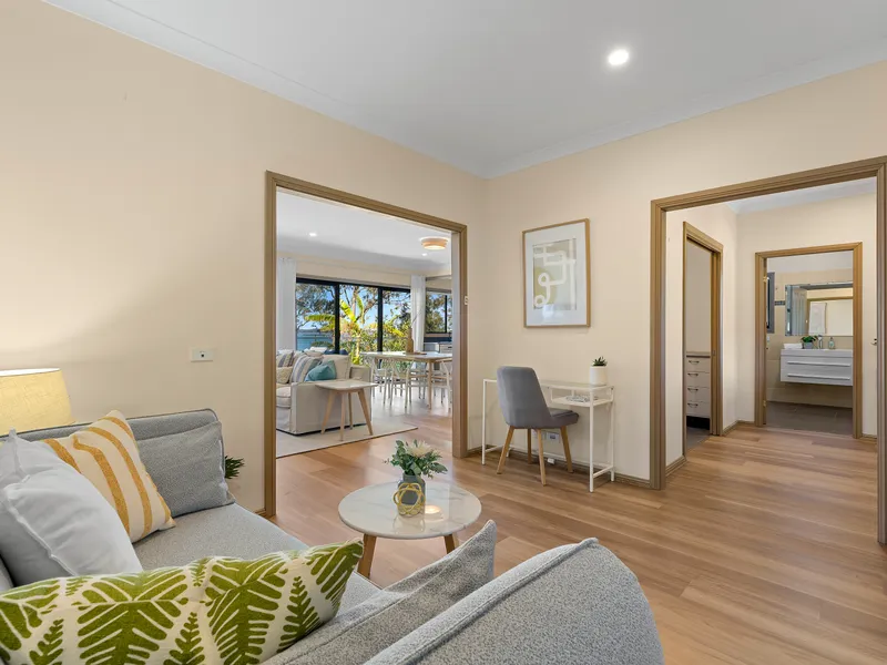 Relax in the comfortable lounge room, the perfect spot to unwind, gather with family and friends, and enjoy the peaceful surroundings.