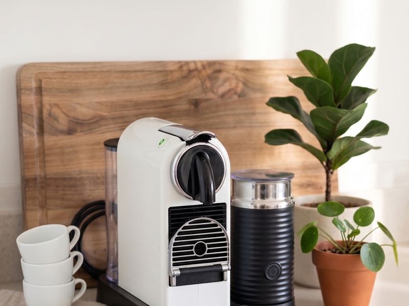 Compact coffee machine station complete with a espresso maker