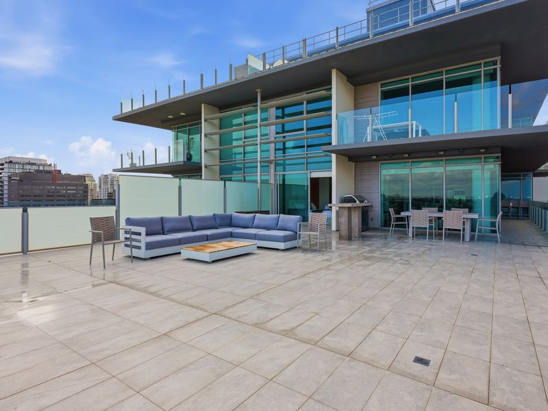 Expansive rooftop terrace with open-air views and modern seating.