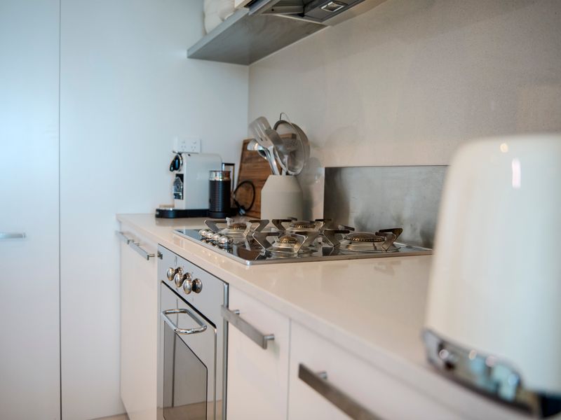 Close-up of the kitchen counter and stovetop appliance setup.