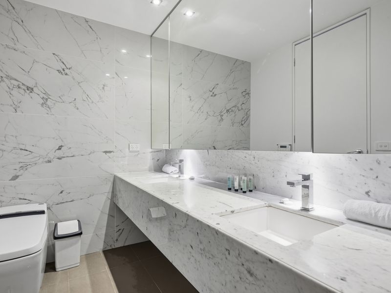 Luxury dual-sink marble vanity setup in the main bathroom.