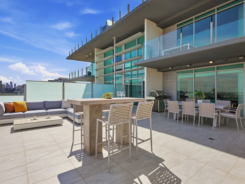 Private outdoor entertaining area with generous seating and city views.