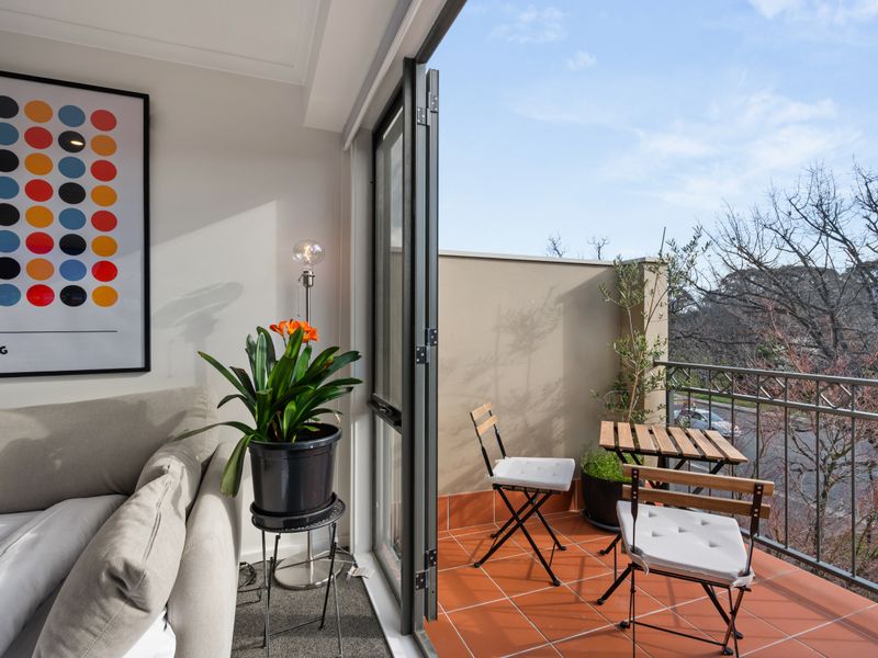 Private balcony surrounded by leafy Turner outlooks.