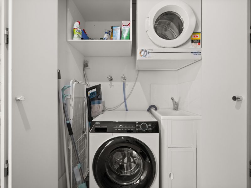 Private in-apartment laundry with washer and dryer for longer stays.