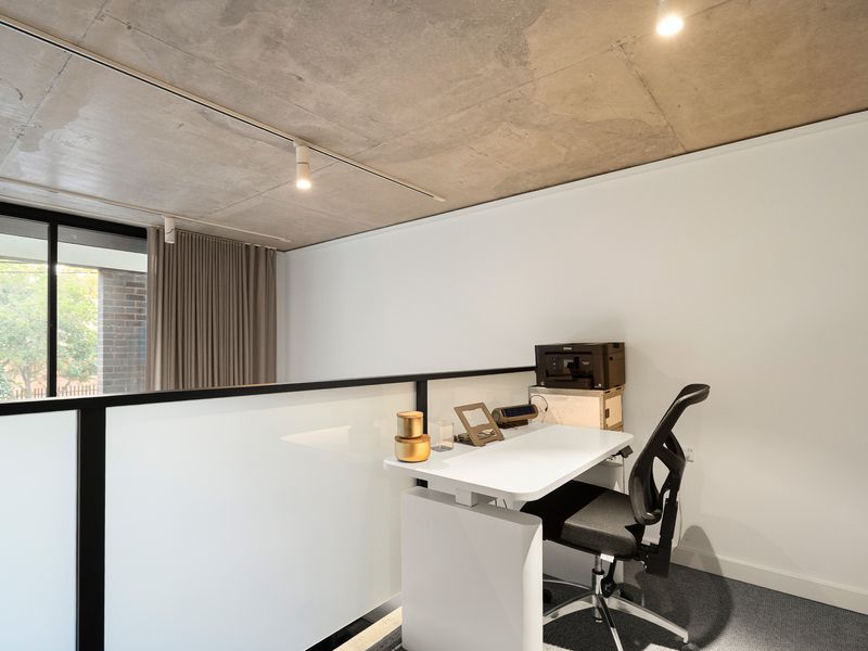 Mezzanine level home office space equipped with a desk and chair.