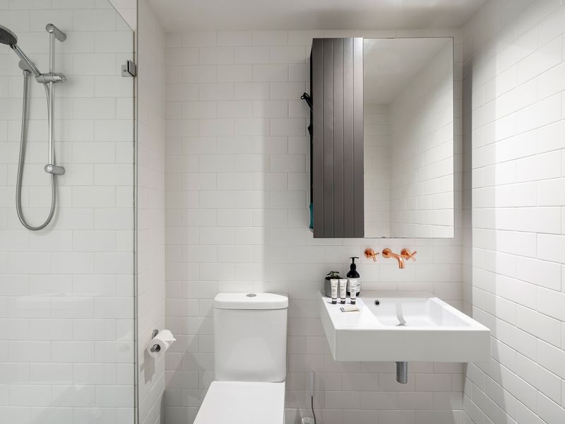 the modern bathroom vanity sink and wall-mounted mirror.