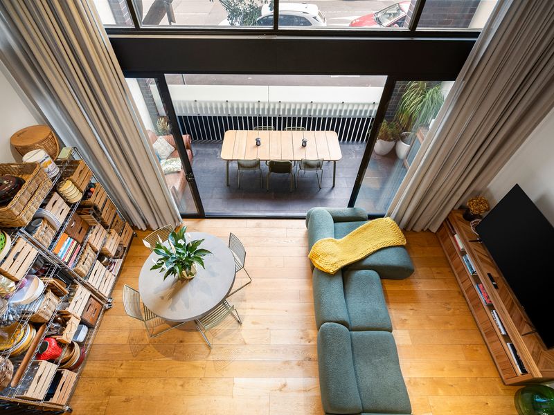 perspective of the open-plan layout showing the seamless flow between the main living spaces and dining zones.