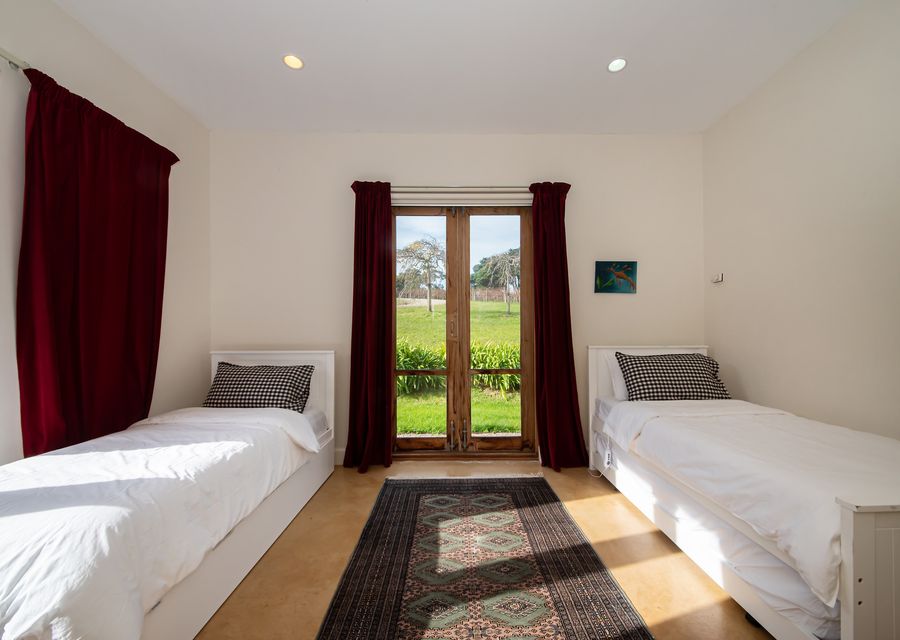 Bedroom five with two singles and a trundle bed