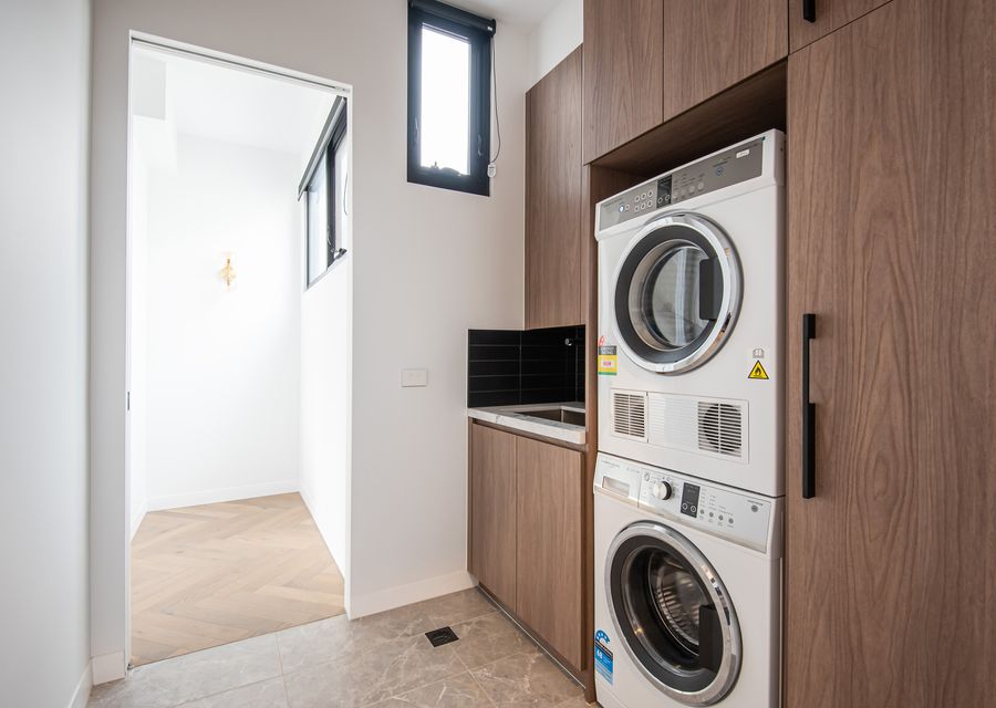 Laundry with washing machine, dryer and powder room