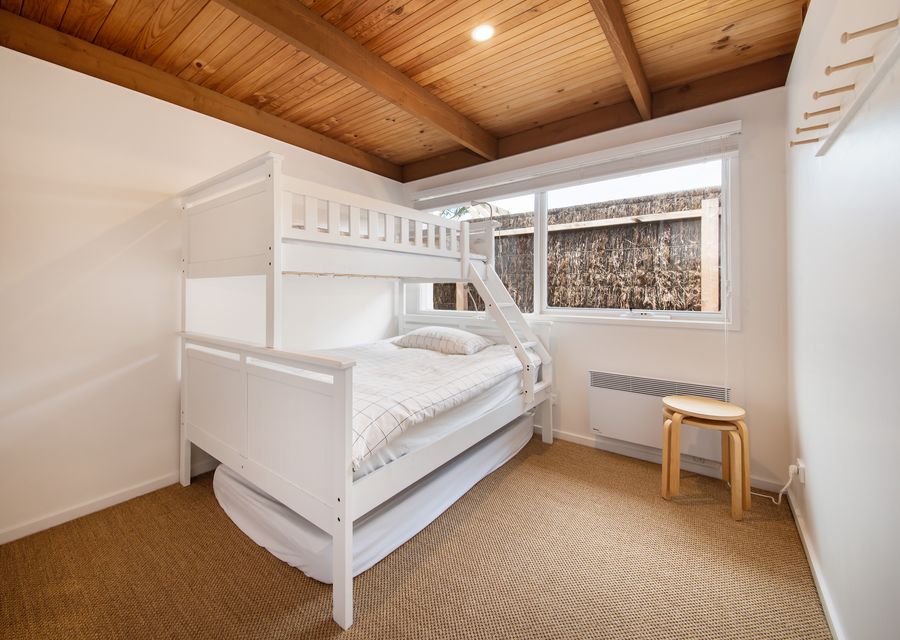 Bedroom three, with double bunk with single above and trundle mattress