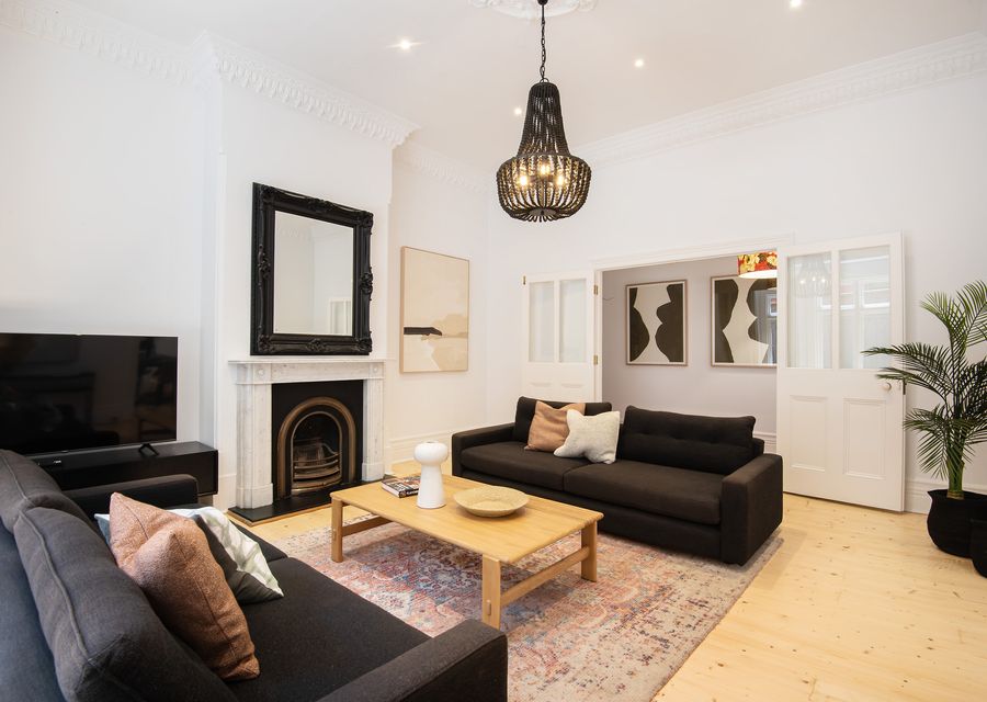 Main living space with smart tv and ornamental fire place